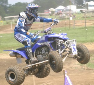 ATV Scene.com's newest test quad, the '04 Yamaha YFZ450 was the talk of the pits. Here Ellis does some "testing" and jumps the High Point step up.