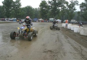 Lap 16 of the pro main event. Here Jones leads Walsh through the slippery infield at snail's pace.