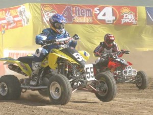 Factory ATV racing is a alive and well. Anaheim's Pro Quad event marked the first Honda vs Suzuki battle of the season. Here, Farr studies Gust's lines in practice.