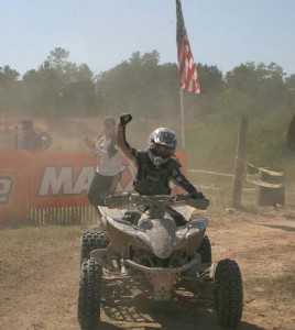 Traci Cecco rides across the finish line and into the ATV racing history books. 