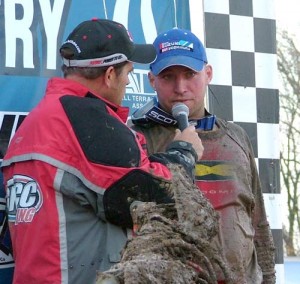 Yokley gets down to business thanking his many sponsors on the podium while Martin with Elka Suspension watches on in the crowd.