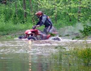 No, this isn't the river, this rider is just heading back to his pits. Many of the pitting areas became flooded after the down fall of rain Friday night. 