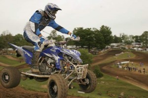 Kory Ellis sails past our cameras with the beautiful Muddy Creek track in the background. 