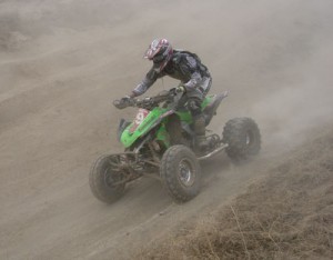Bronson Bundy # 69 tests out his new Kawi on the down hill section.