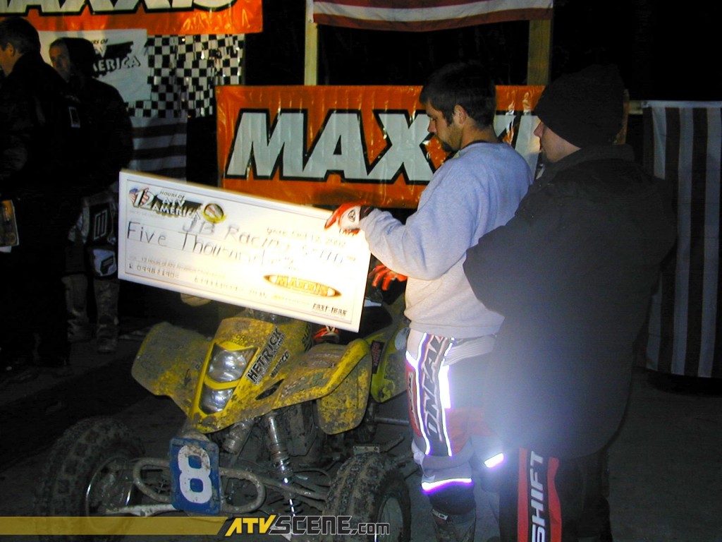  Jathan Seale displays the second place check for his JB Racing teammates.